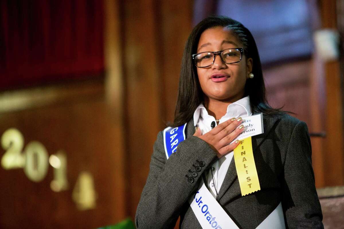 Kennady Roberson delivers her speech as a tribute to Dr. Martin Luther King Jr. during the 18th Annual Gardere MLK Jr. Oratory Competition, Friday, Jan. 17, 2014, in Houston. Roberson is a student at Lockhart Elementary School.