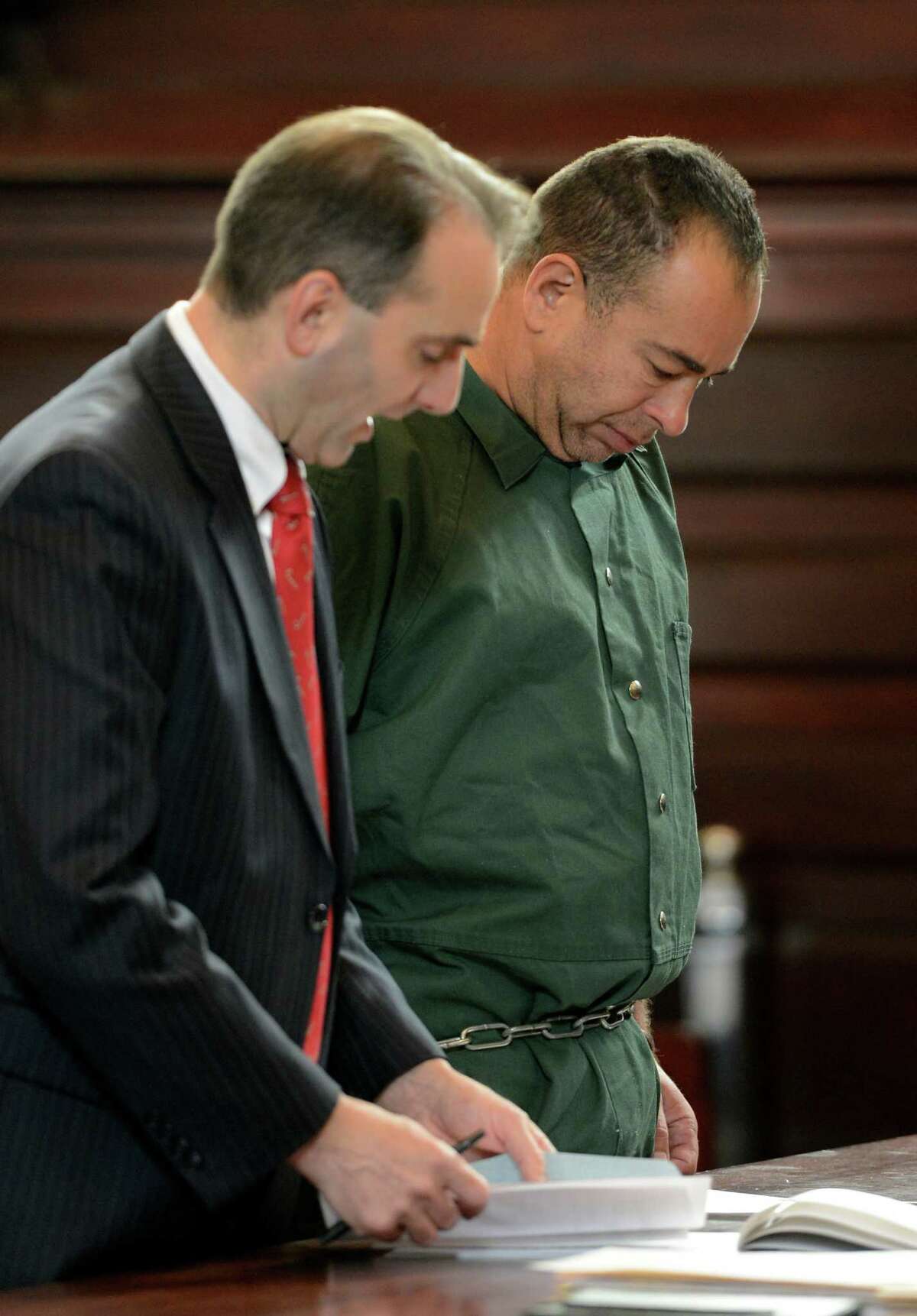 Dennis Bassat, right, former executive director of 820 River Street Inc. represented by Public Defender John Turi, was arraigned on grand larceny charges in front of Judge Andrew Ceresia at the Rensselaer County Courthouse in Troy, N.Y. Dec. 20, 2012. (Skip Dickstein/Times Union)