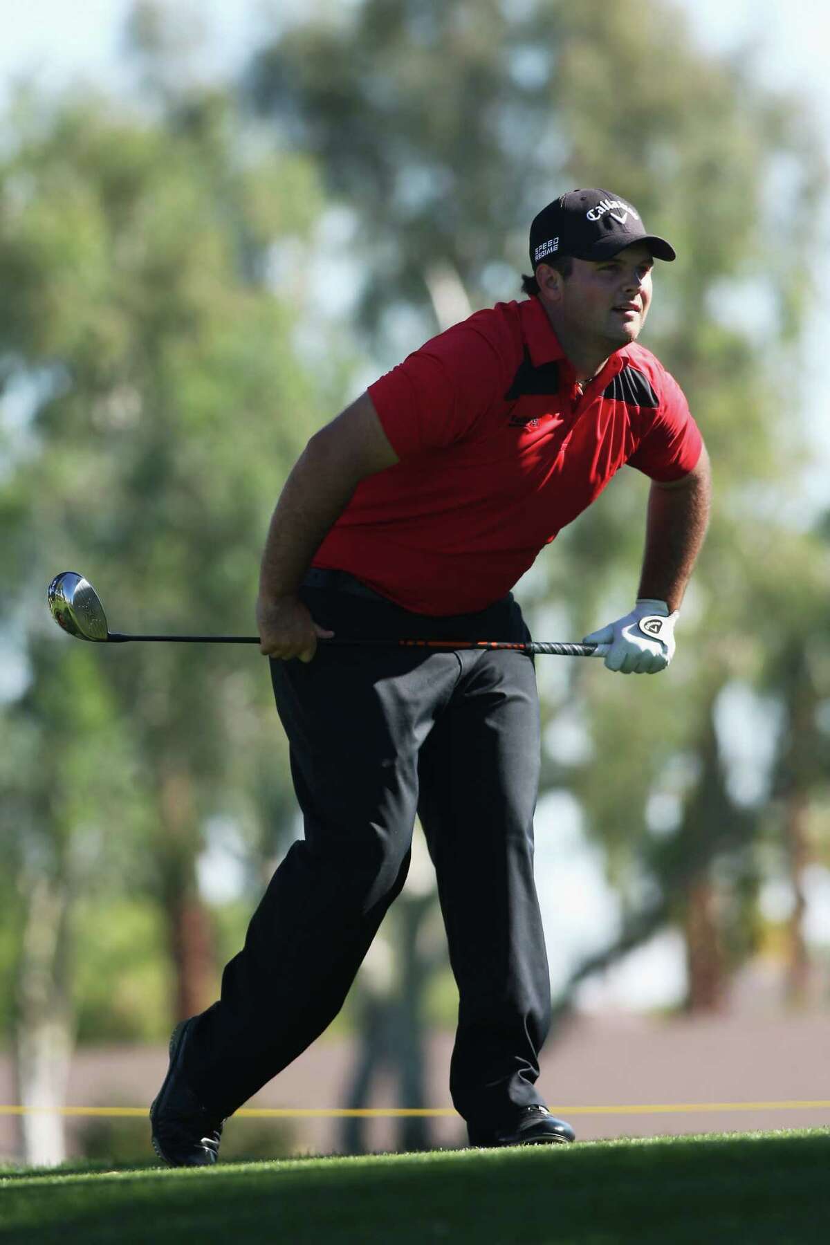 Spring's Patrick Reed tracks the flight of his tee shot as he recorded a second straight 63 on Friday.