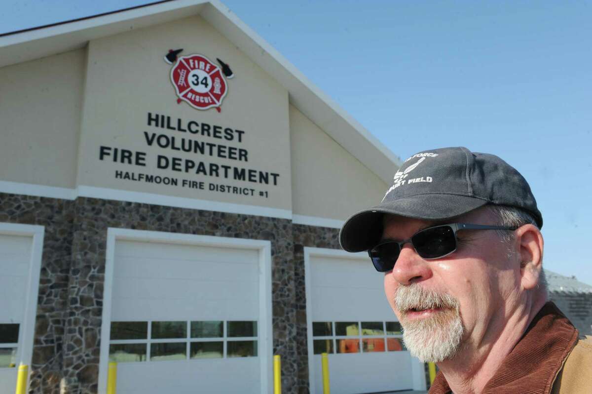 George McBride in front of the Hillcrest Fire Department on Friday Jan. 17, 2014 in Halfmoon, N.Y. There's a movement to save the siren at the Hillcrest Fire Department, where commissioners have decided not to replace it after nearly 50 years in use. McBride lives about 500 feet from station and says sirens ensure good response times.(Michael P. Farrell/Times Union)