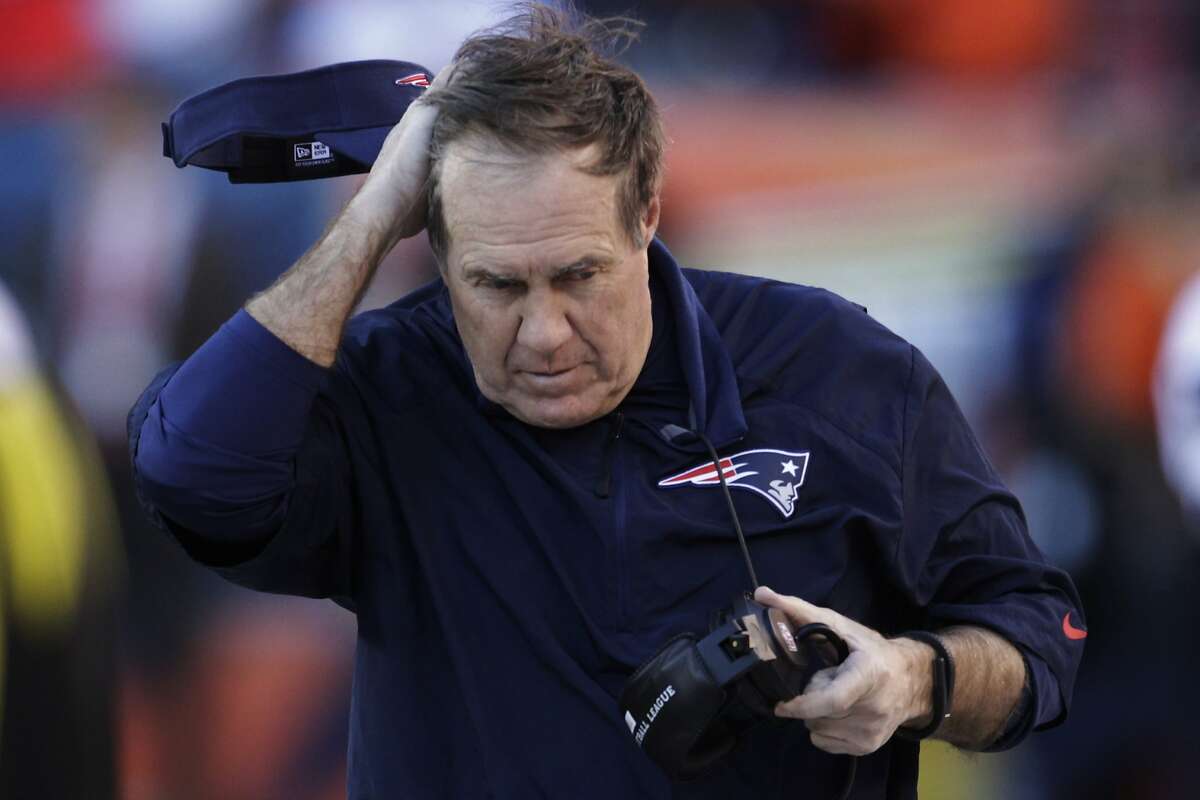 In 2007, Bill Belichick and the New England Patriots were busted for "Spy-gate". The Patriots had been secretly videotaping the defensive signals of the New York Jets and were caught. Belichick was fined $500,000 and the team lost a first-round draft pick. (AP Photo/Joe Mahoney)