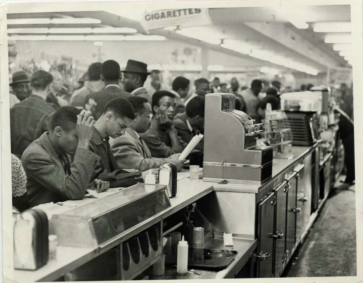 Student demonstrators, members of the Progressive Youth Association, sit down in protest at a white lunch counter at Weingarten's No. 26, 4110 Almeda, Houston, on March 4, 1960. The students, mostly from TSU, occupied all 30 stools at Wengarten's lunch counter.  