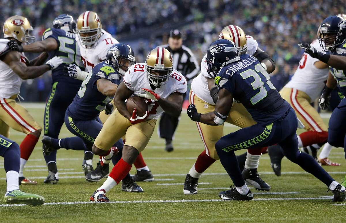 49ers Frank Gore, (21) carries the ball to set up a third quarter score for the 49ers as San Francisco who went on to lose to the Seattle Seahawks 23-17 in the NFC Championship game at CenturyLink Field in Seattle, Washington on Sunday Jan. 19, 2014.