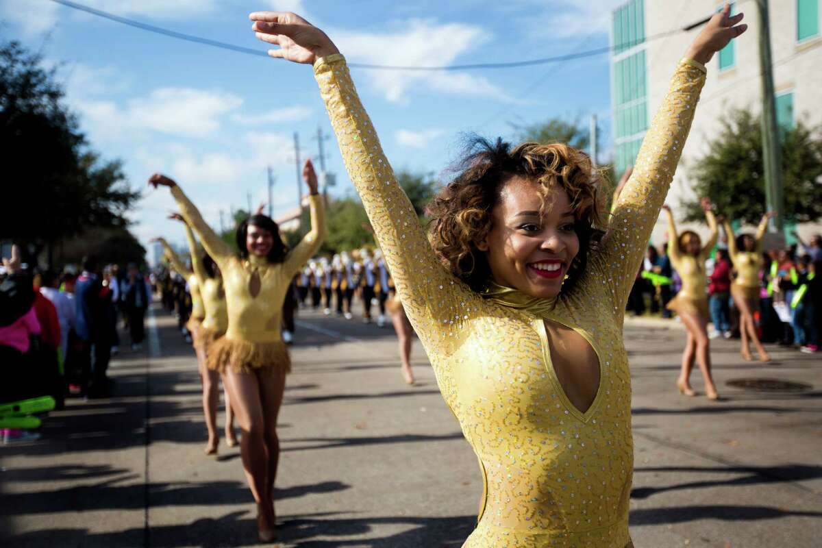A Prairie View A&M University dancer performs to the rhythm of their marching band "Marching Storm" at the 20th Annual MLK Grande Parade, Monday, Jan. 20, 2014, in Houston.