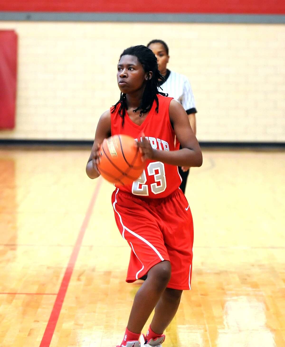 Houston Waltrip girls basketball team, 2013. Waltrip competes in UIL District 214A. Laterra Turner (23) of Waltrip, sets up to shoot an outside shot.