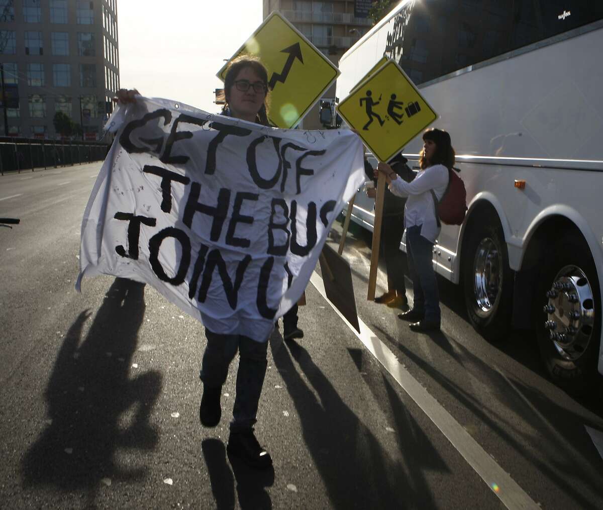Protestors block a Facebook bus heading to Menlo Park on 8th at Market streets in San Francisco, Calif., on Tuesday, January 22, 2014. The San Francisco Metropolitan Transportation Agency votes on an 18-month pilot plan allowing Google buses to use designated Muni bus stops to pick up and drop off tech commuters to Silicon Valley.