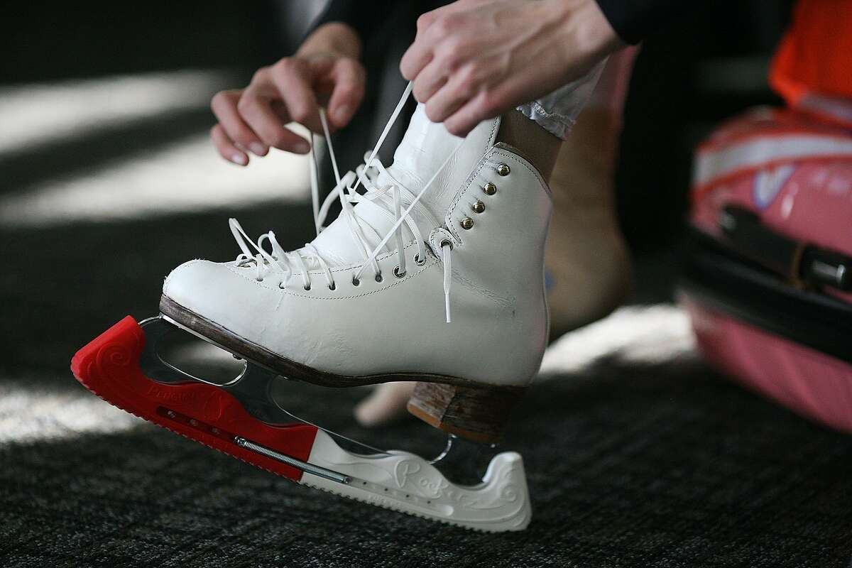 Polina Edmunds ties her skates before practicing at the Sharks Ice in San Jose, Calif. on Monday, Jan, 21, 2014. The 15-year-old sophomore will be competing in the upcoming Sochi Olympics.