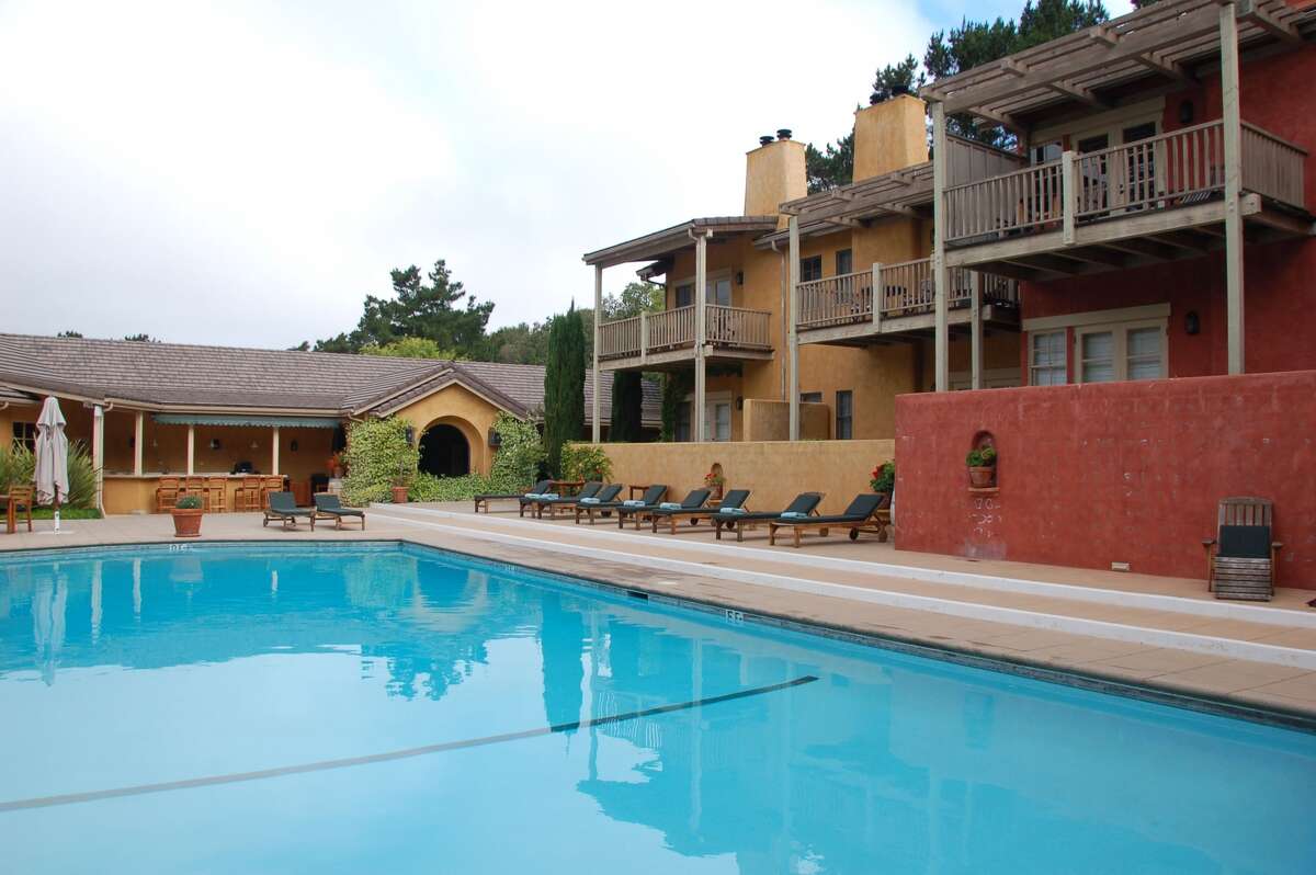 One of the ranch-style wings of Bernardus Lodge overlooks a large heated pool and sundeck.