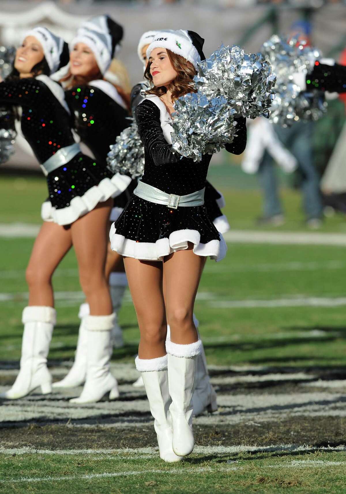 Oakland Raiders cheerleader Lacy T., seen in 2013, was a plaintiff in a lawsuit accusing the team of violating wage laws.