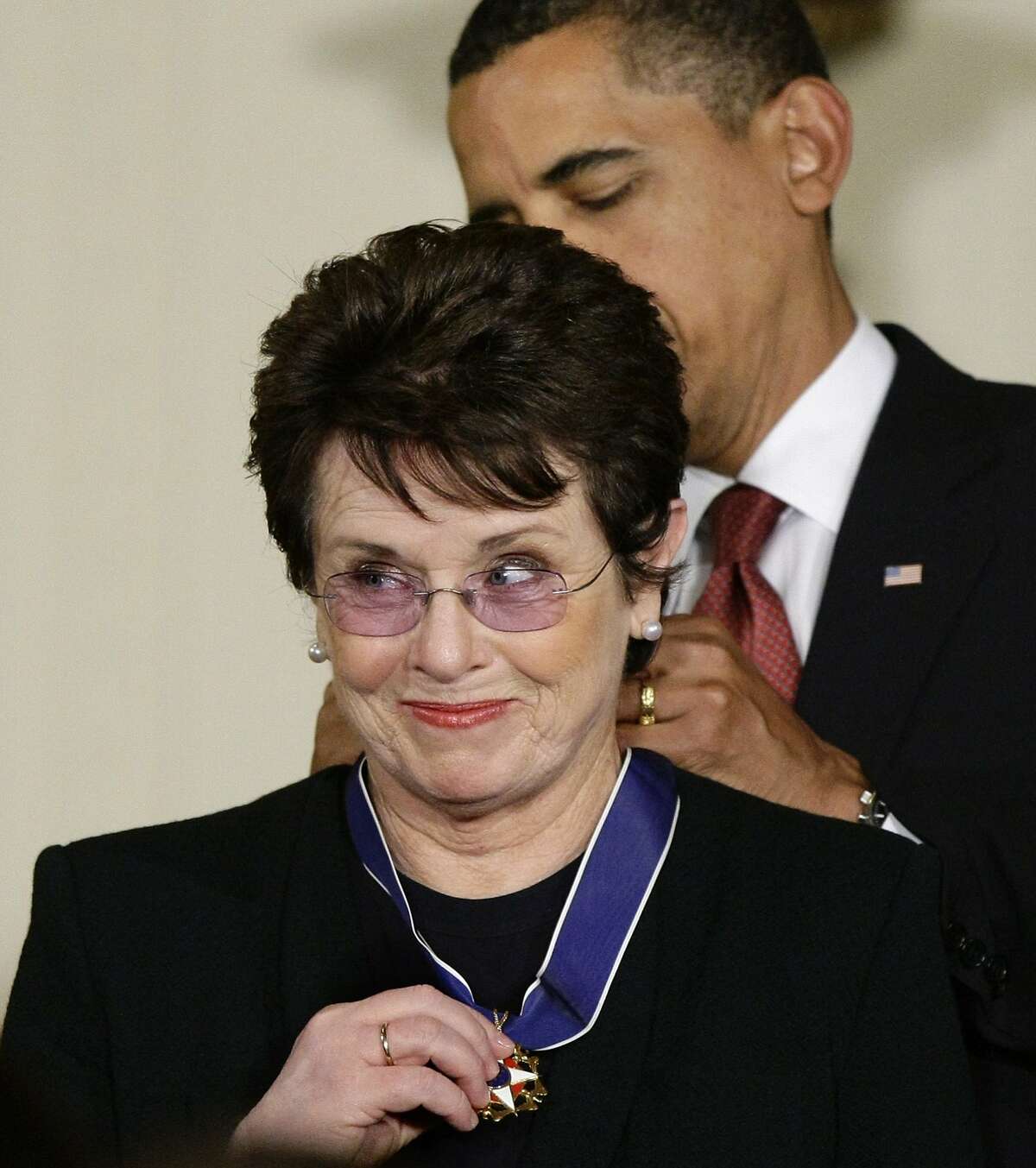 FILE - In this Aug. 12, 2009 file photo, President Barack Obama presents the 2009 Presidential Medal of Freedom to Billie Jean King, known for winning the famous "Battle of the Sexes" tennis match, and championing gender equality issues, during ceremonies at the White House in Washington. King believes standing up to discrimination is the best way to combat it. She will help lead the U.S. delegation in the opening ceremonies at the Sochi Olympics in Russia, which recently passed an anti-gay law. (AP Photo/J. Scott Applewhite, File)