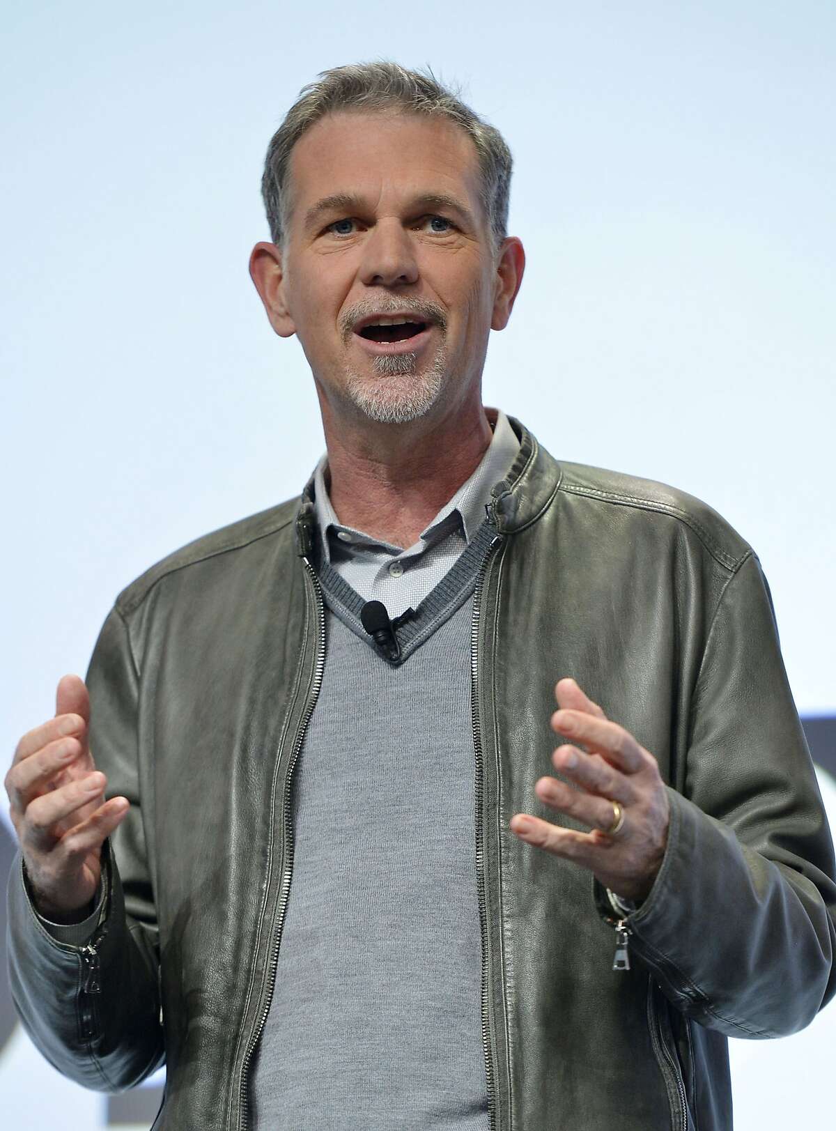 Reed Hastings, chief executive officer of Netflix talks to the media about a new partnership in providing 4K content streaming during the Sony news conference at the International Consumer Electronics Show Monday, Jan. 6, 2014, in Las Vegas. (AP Photo/Jack Dempsey)