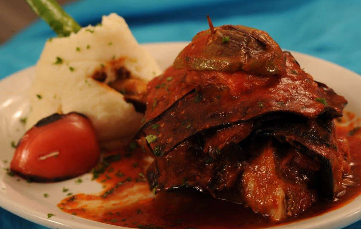 Eggplant-wrapped braised lamb shanks are flavorful and tender at the Turquoise Grill.