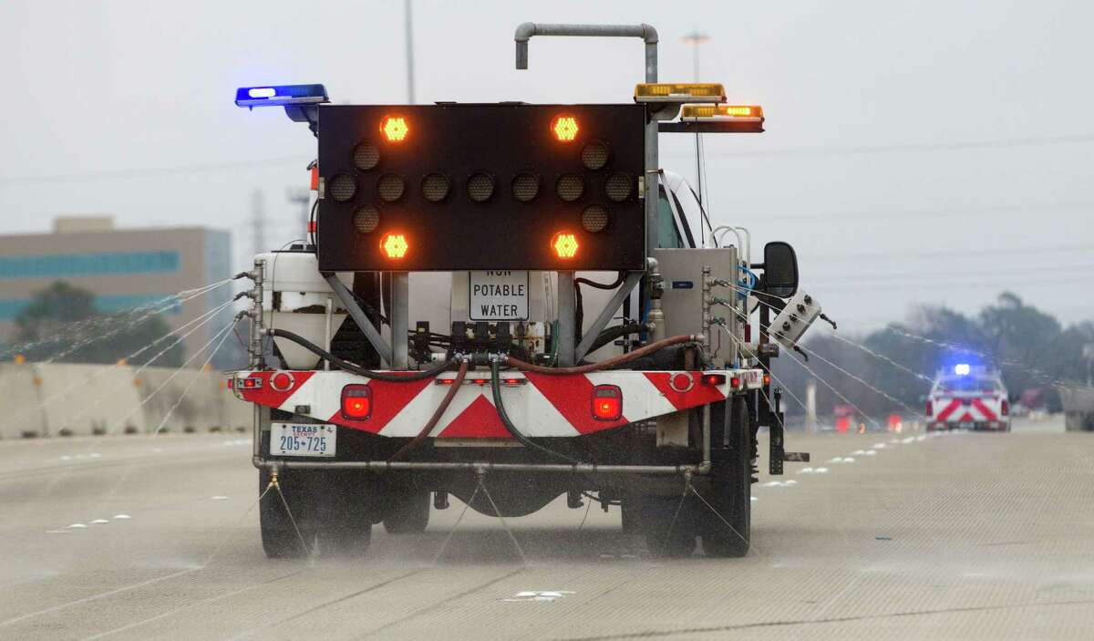 Texas Department of Transportation trucks spray de-icing chemicals on Loop 610 ahead of freezing overnight temps in 2014. 