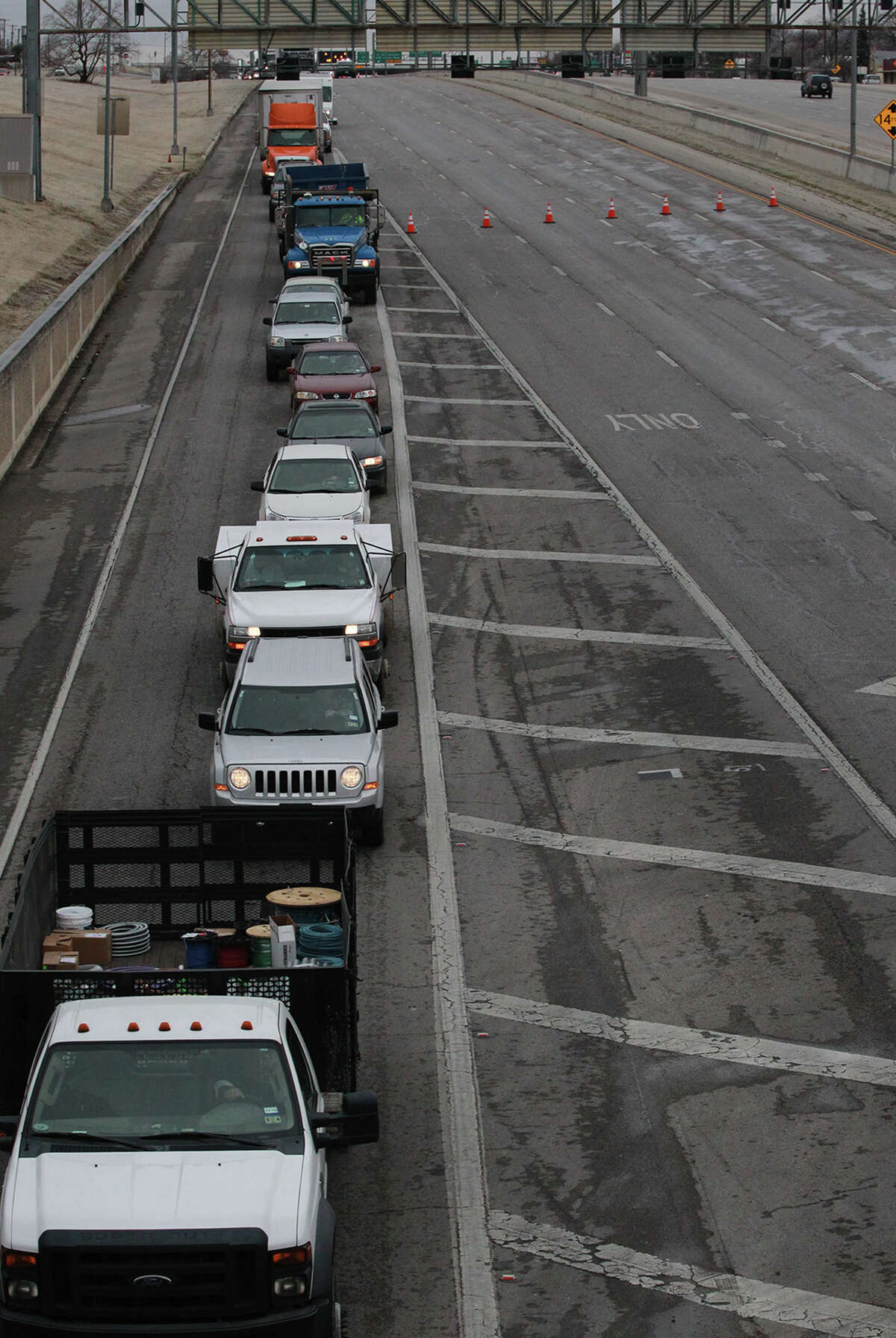 Traffic is diverted off of IH-35 southbound at New Braunfels Avenue Friday January 24, 2014 because of iced over bridges and multiple traffic accidents.