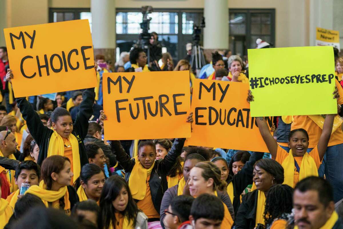 YES Prep students hold up signs during the Official Kickoff of National School Choice Week at Union Station on Saturday, Jan. 25, 2014, in Houston.  ( Smiley N. Pool / Houston Chronicle )
