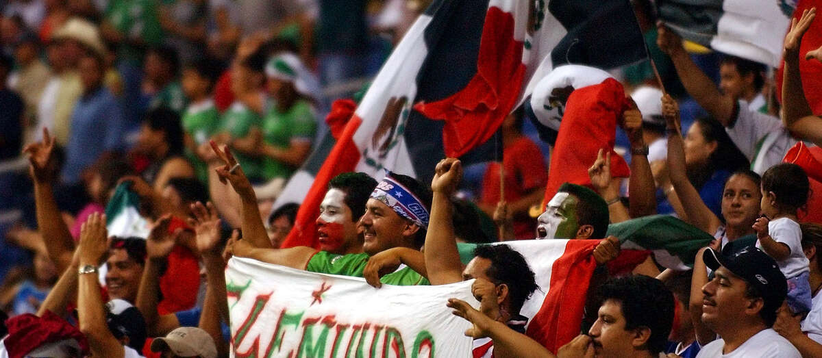 Mexico fans cheer in the second half of their World Cup Qualifier Saturday, June 19, 2004 at the Alamodome. BAHRAM MARK SOBHANI / STAFF