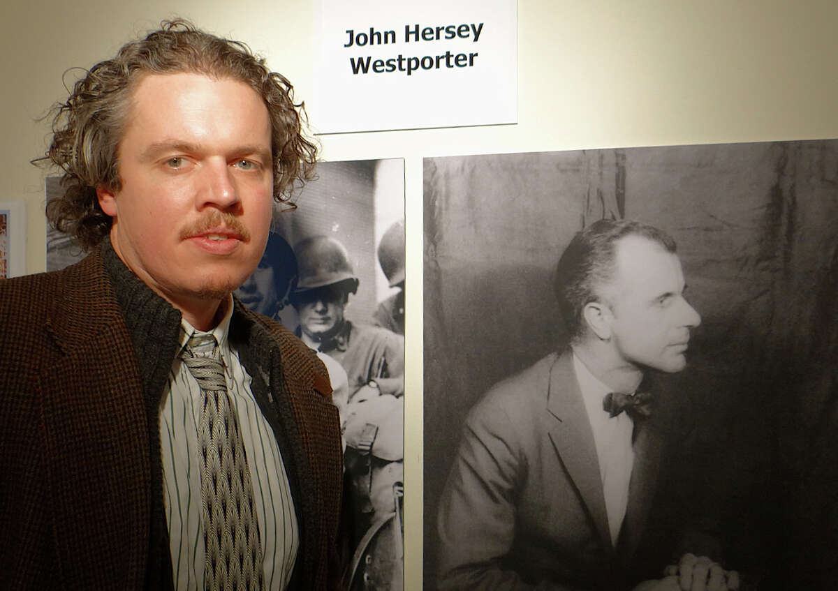 Cannon Hersey, son of the late journalist John Hersey, beside a display dedicated to the writer's work at the Westport Historical Society.