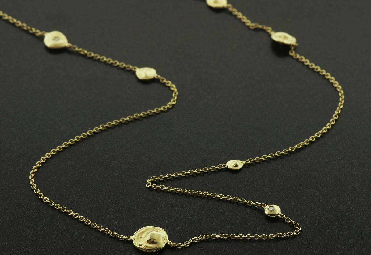 Burlingame jewelry designer Christine Guibara is influenced by nature's patterns, colors and textures. This pebble diamond necklace features pebbles in 18K gold with tiny diamonds, and retails for $2,800 at www.christineguibara.com.