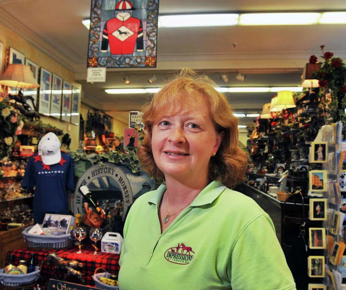Marianne Barker, owner of Impressions of Saratoga, inside her store on Broadway in Saratoga Springs Thursday July 16, 2009. (John Carl D'Annibale / Times Union)