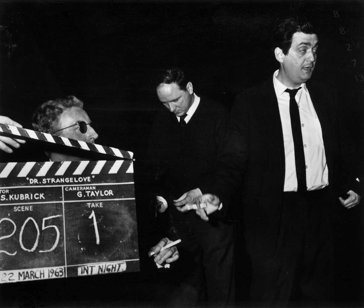 Peter Sellers, left, and director Stanley Kubrick, right, with a clapperboard during the filming of 'Dr Strangelove or How I Learned to Stop Worrying and Love the Bomb'.