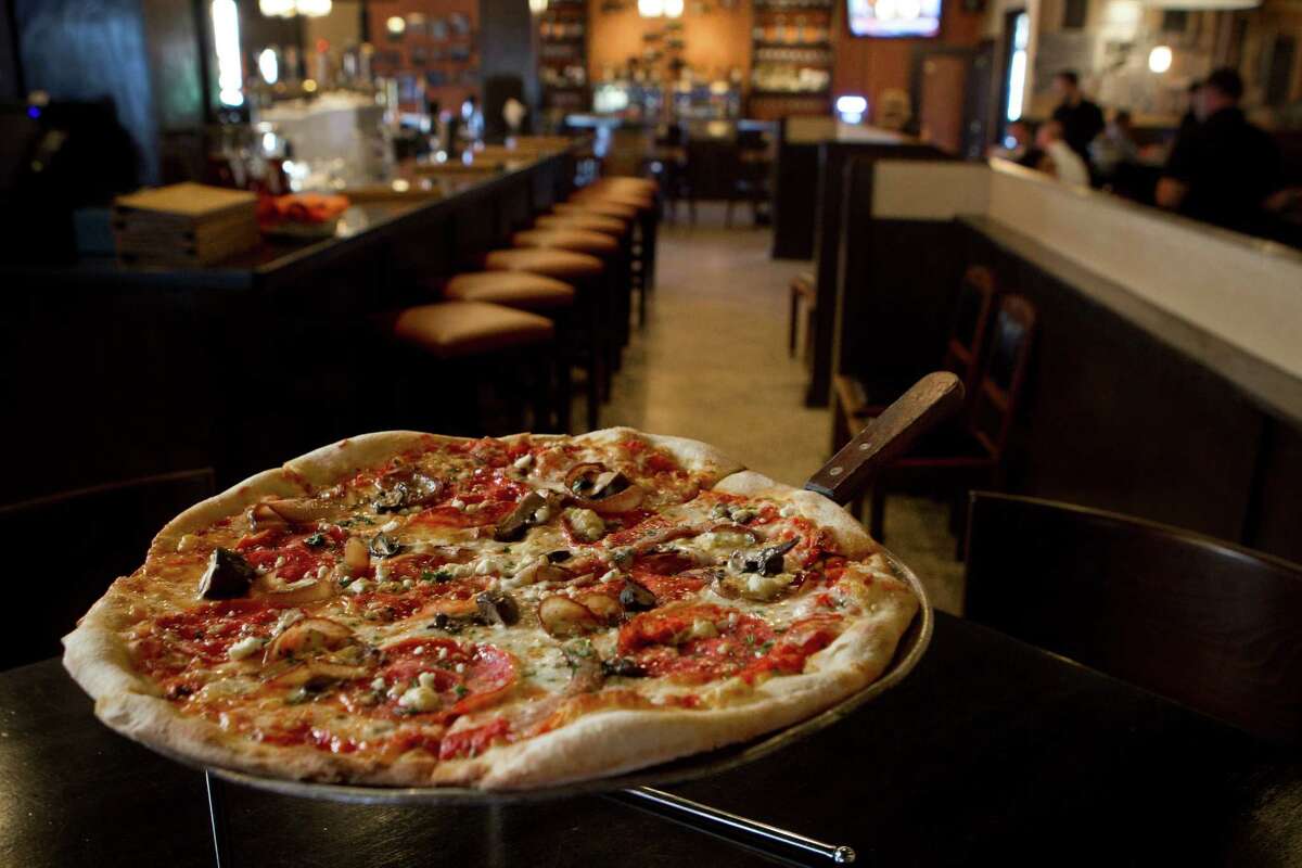 Pizza Toscana pizza is a delightful offering to pair with beer or wine at Crisp.=