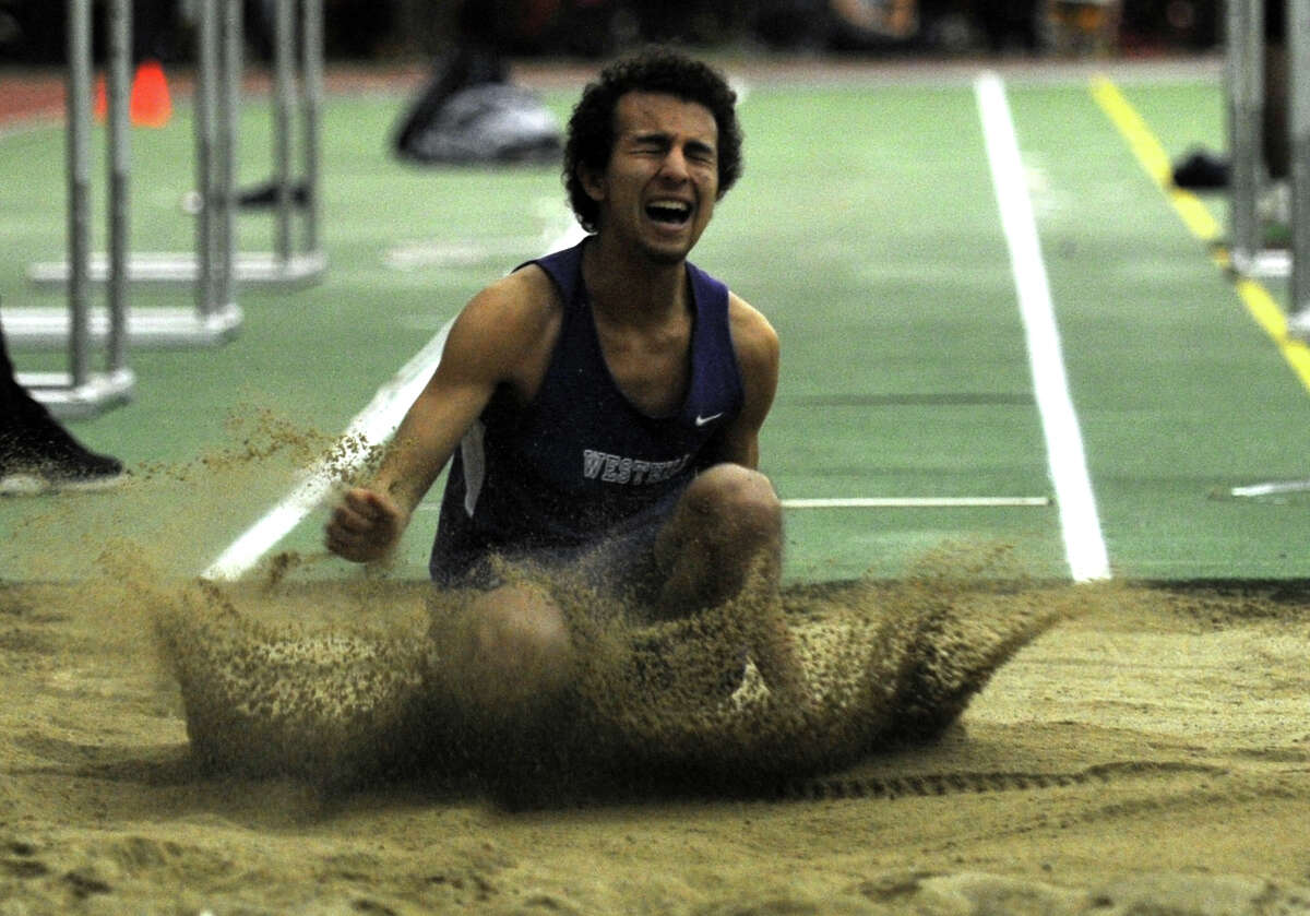 Westhill's Daniel Sanchez competes in the long jump event during the FCIAC Indoor Track Championships Wednesday, Jan. 29, 2014, at the Floyd Little Athletic Center in New Haven, Conn.