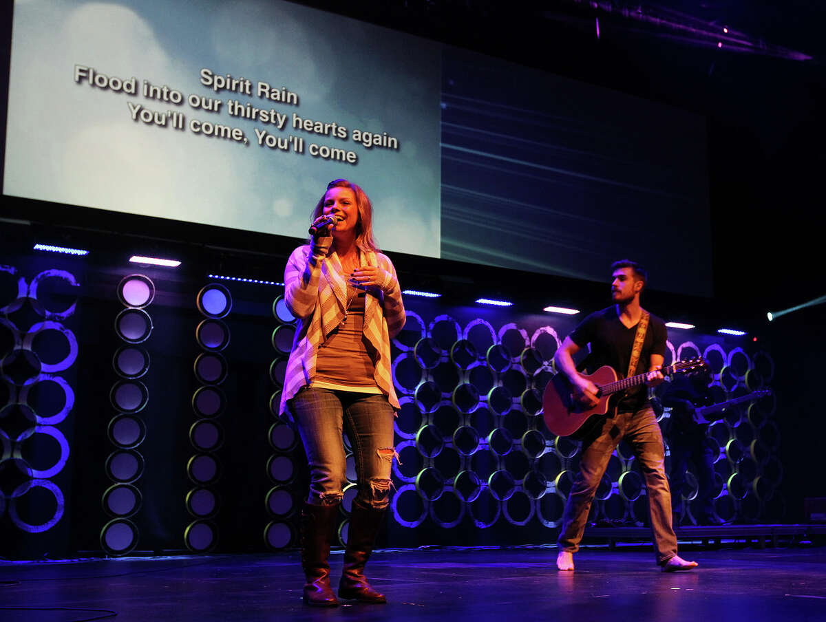 Stephanie Gorena and Clayton Tyner perform during Sunday Service at the City Church's Bandera Road campus, Jan. 26, 2014. The church's alternative-style rock band draws large number of same-sex couples and gay people.