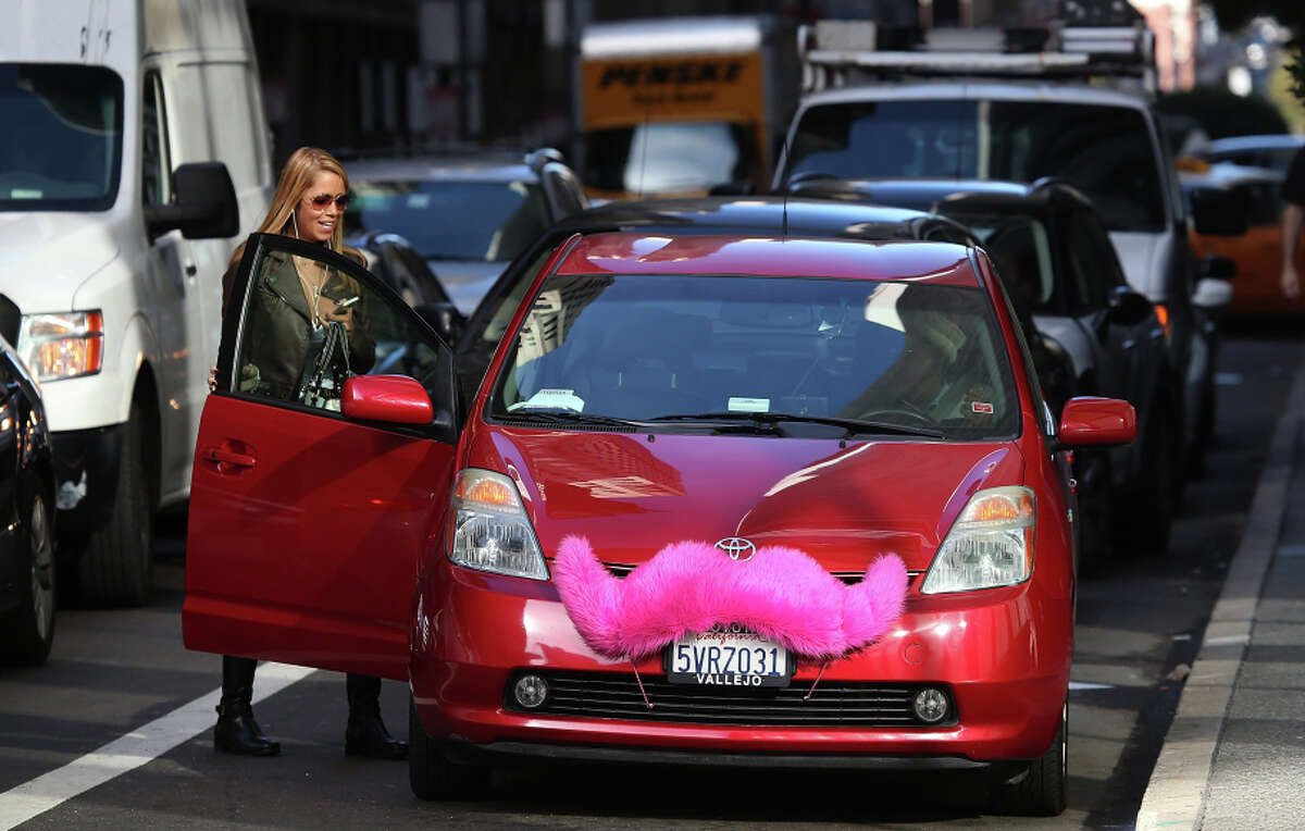 A Lyft customer gets into a car in San Francisco earlier this year.