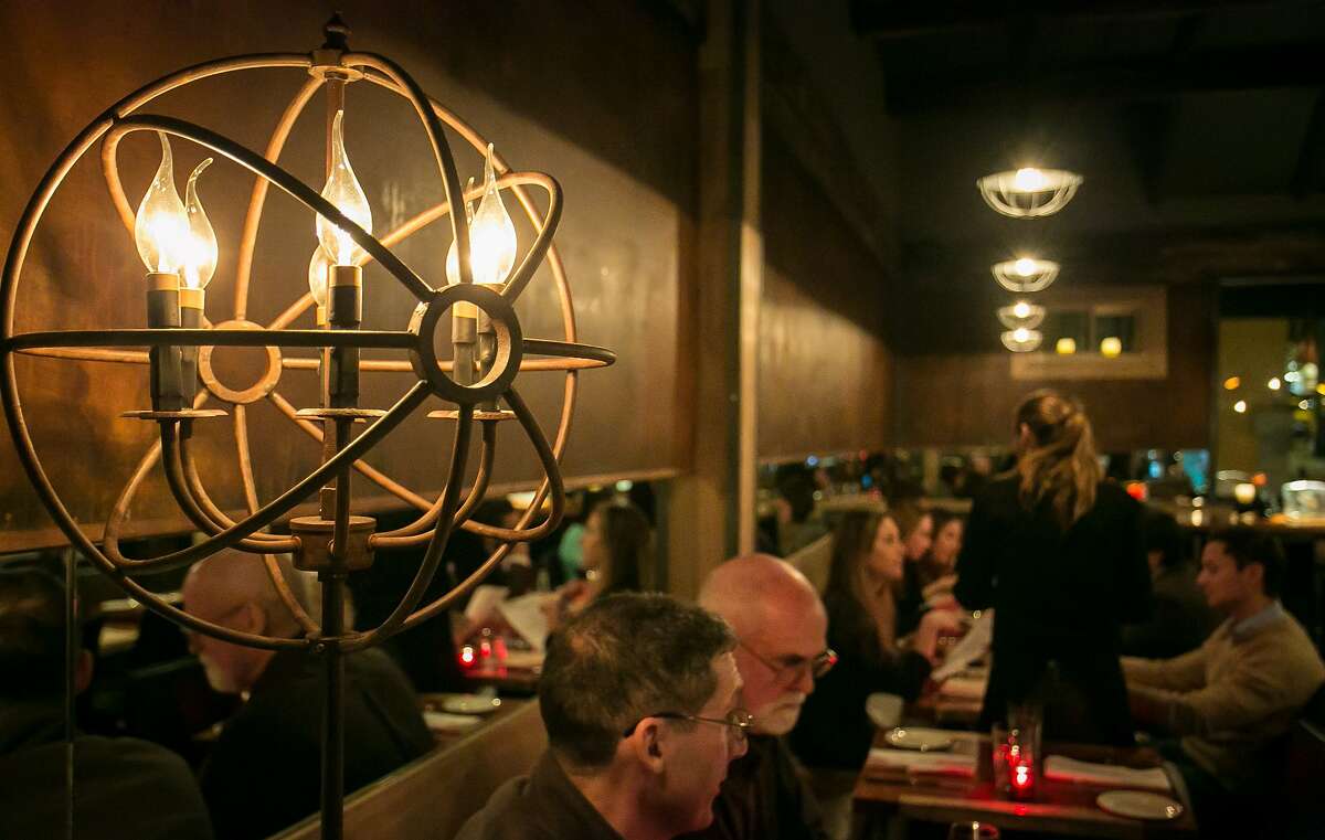 Diners enjoy dinner at Ala Romana restaurant in San Francisco, Calif., on January 30th, 2014.