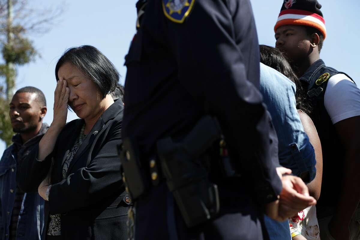 Oakland Mayor Jean Quan collects her thoughts as she and the Police Chief Sean Whent answer questions regarding the killing of Anrew Thomas, 20, and Baby Drew Jackson, 1, Wednesday, August 7, 2013 in Oakland, Calif. The double homicide accured early Wednesday morning,