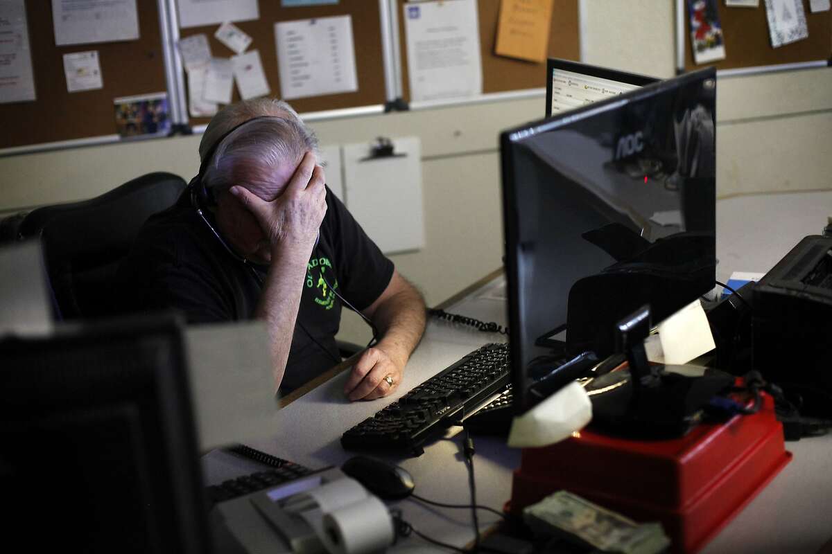 Pat LaRocca, a dispatcher at DeSoto Cab, gives his eyes a rest from the three screens he uses to field calls and keep track of drivers in San Francisco, Calif., on Monday, January 27, 2014. LaRocca has been with the company for 49 years.