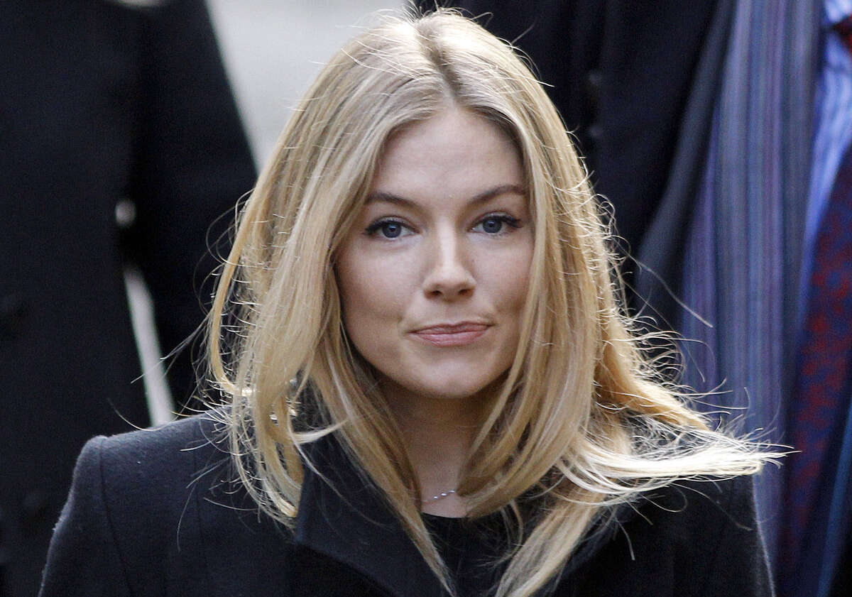British actress Sienna Miller arrives at the Royal Courts of Justice in central London to testify about her experience having her phone message to actor Daniel Craig hacked.