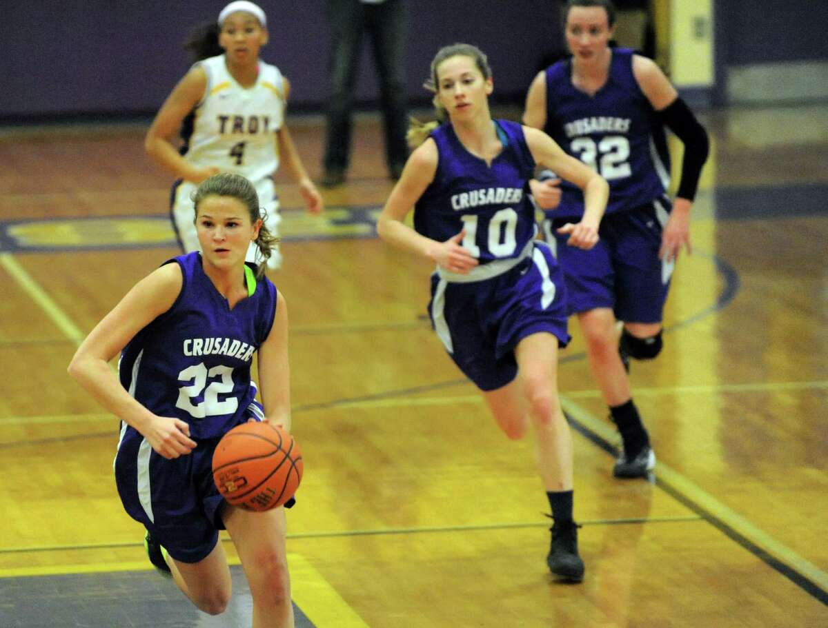 Catholic Central's Madison Purcell, left, drives the ball up court during their basketball game against Troy High on Friday, Jan. 31, 2014, at Troy High in Troy, N.Y. (Cindy Schultz / Times Union)