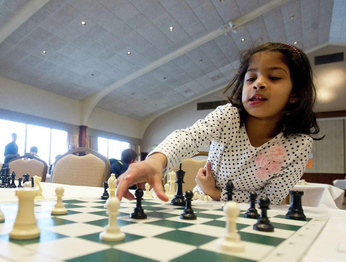 Vedha Kongettira plays a chess game during the National Educational Chess Association's tournament at the Italian Center in Stamford, Conn., on Saturday, February 1, 2014.