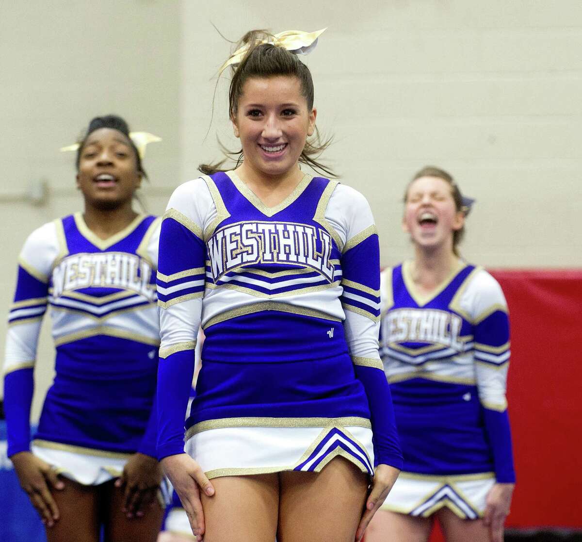 Zoe Carrillo of Westhill High School competes in the FCIAC cheerleading championships at Fairfield Warde High School in Fairfield, Conn., on Saturday, February 1, 2014.