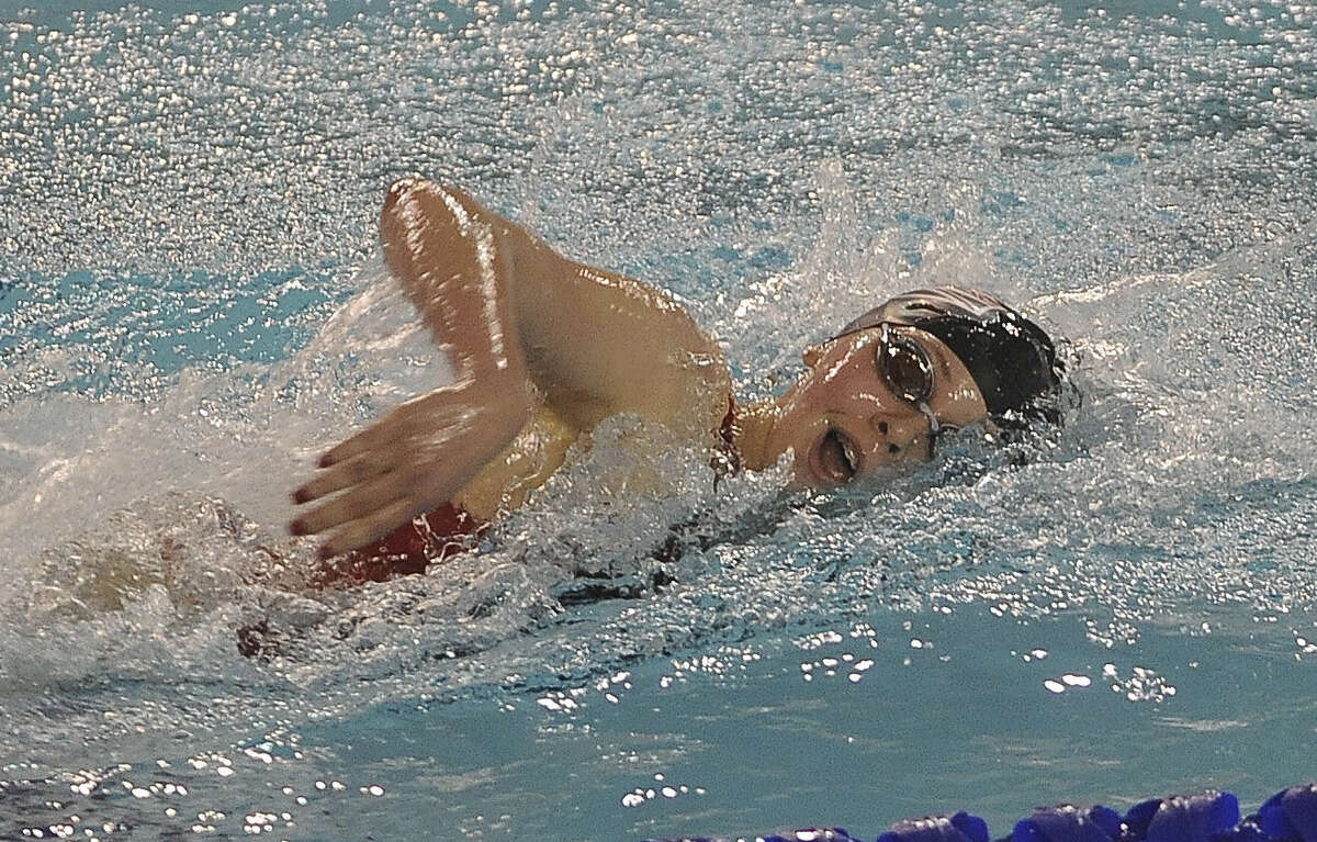 Haley Herzberg of Churchill competes in the girls 500-yard freestyle, one of two individual events she won at the District 26-5A meet at Davis Natatorium.
