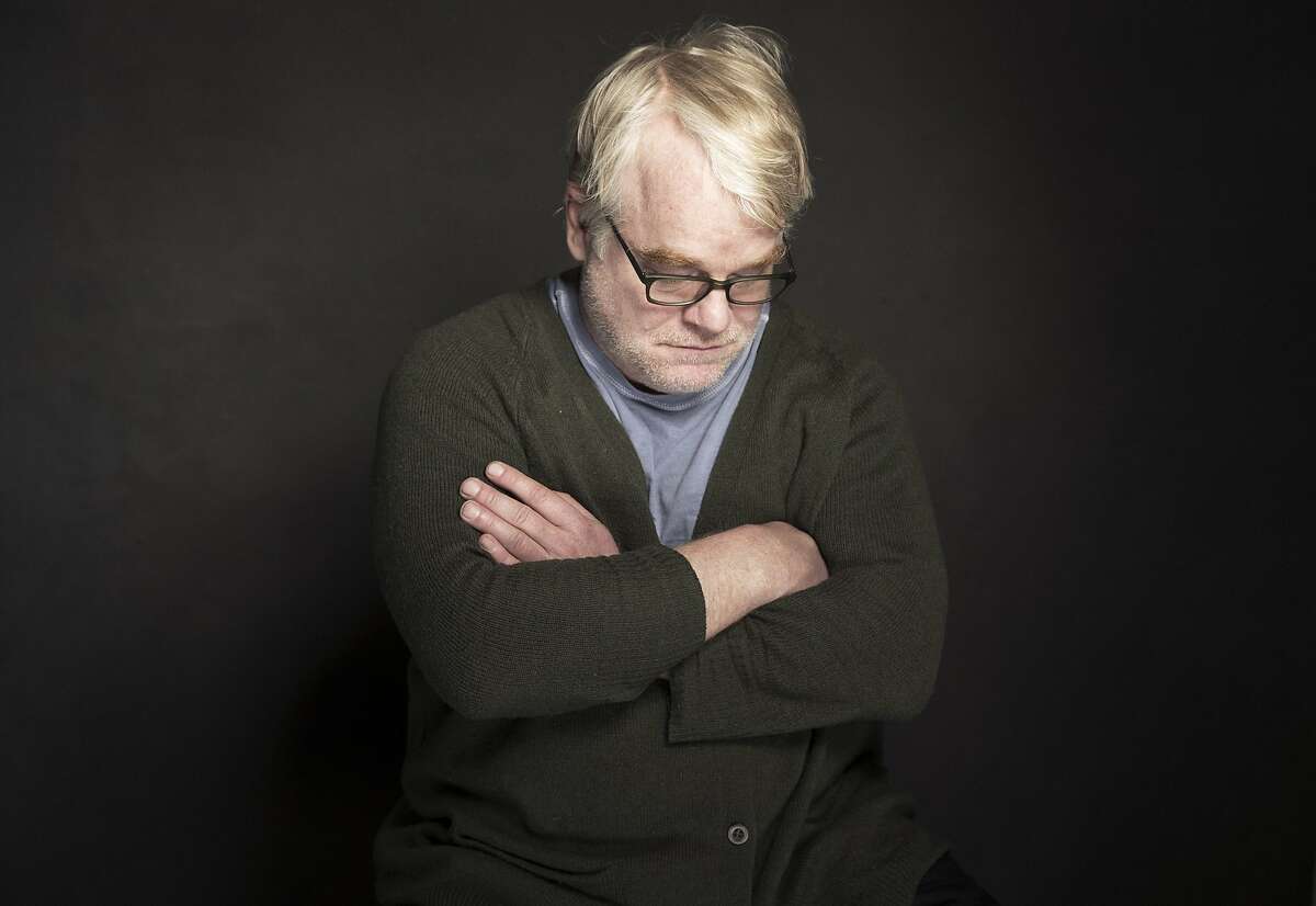 This photo taken Jan. 19, 2014, shows Phillip Seymour Hoffman posing for a portrait at The Collective and Gibson Lounge Powered by CEG, during the Sundance Film Festival, in Park City, Utah. Hoffman, who won the Oscar for his portrayal of writer Truman Capote and created a gallery of slackers, charlatans and other characters so vivid that he was regarded as one of the world's finest actors, was found dead in his New York apartment Sunday with what officials said was a needle in his arm. He was 46. (Photo by Victoria Will/Invision/AP)