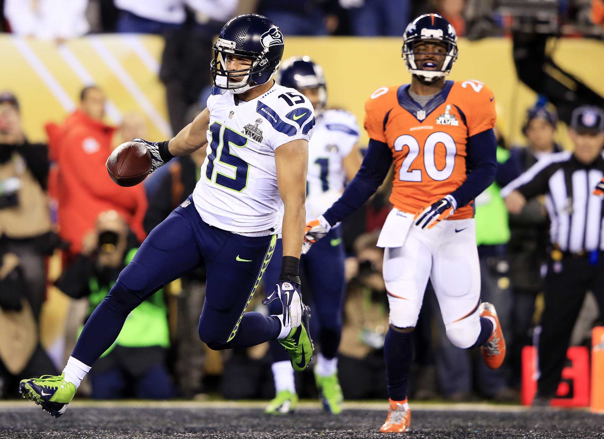 Seattle Seahawks kick returner Percy Harvin returns a kick off 87 yards for  a touchdown against the Denver Broncos to start the third quarter of Super  Bowl XLVIII at MetLife Stadium in