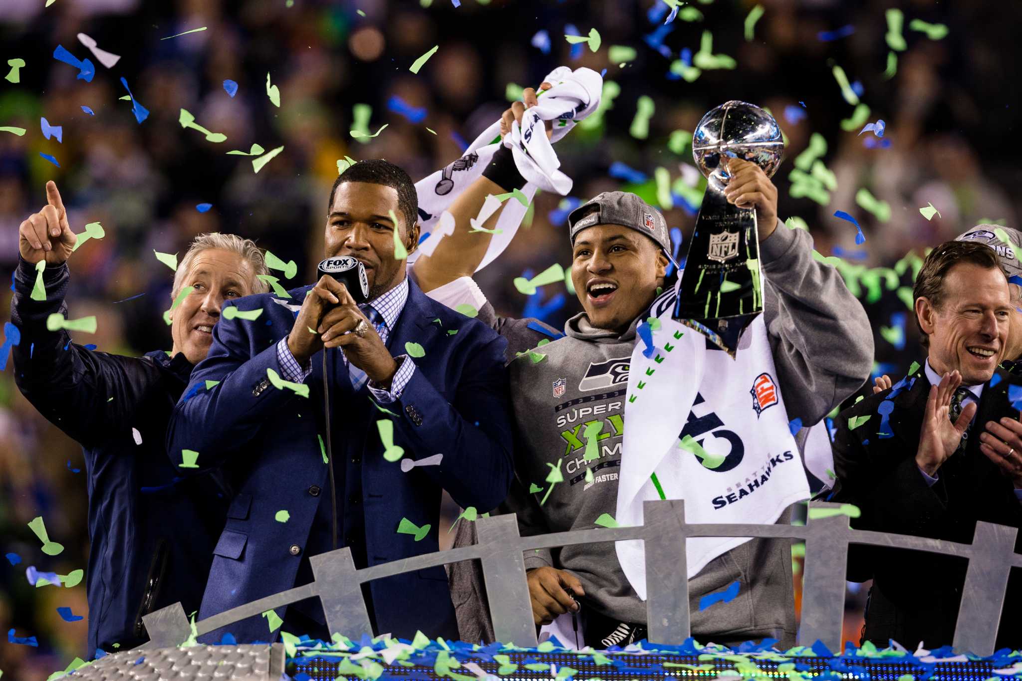 Seattle Seahawks tackle Russell Okung kisses the Vince Lombardi