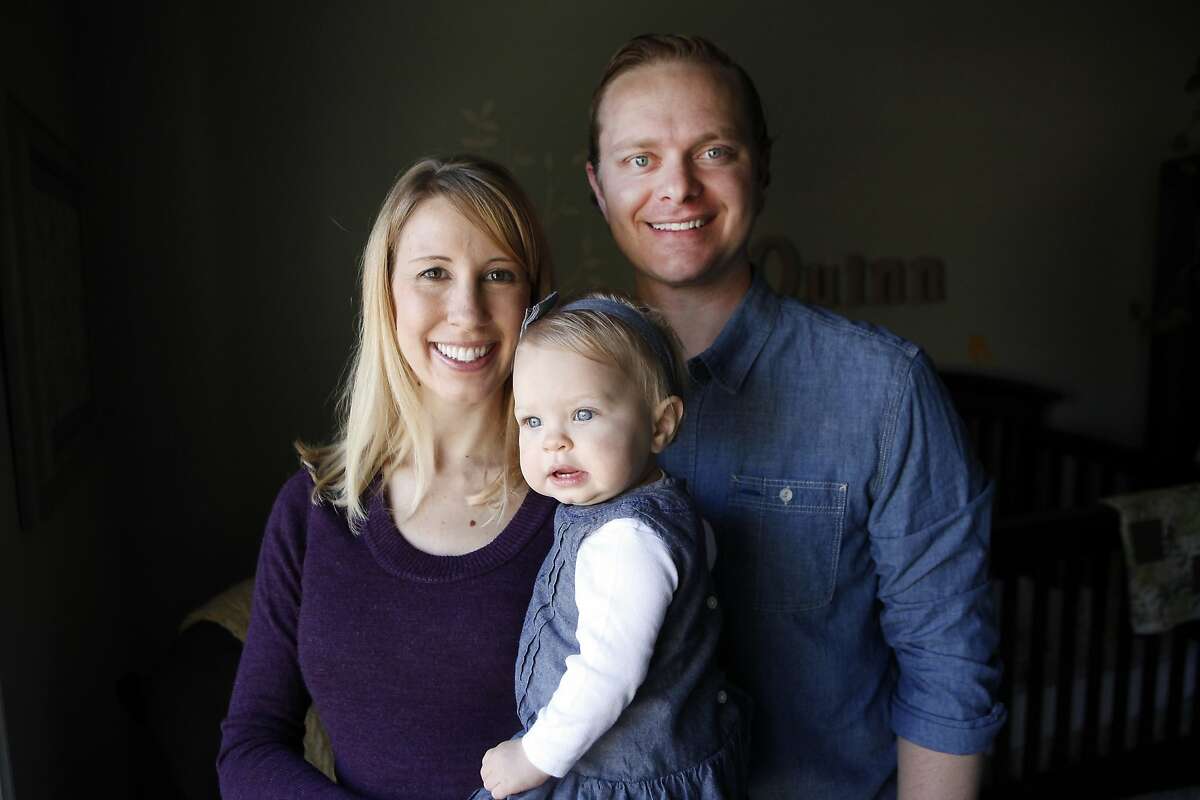 Elizabeth and Tyler Barnett with with their 10 month old daughter Quinn at their home in San Jose, CA, Thursday, January 25, 2014. Elizabeth lost her first baby when she was diagnosed with severe preeclampsia 23 weeks into her pregnant in 2011. She was able to recover and have a healthy, preeclampsia-free pregnancy with Quinn and now is pregnant again with a second girl.