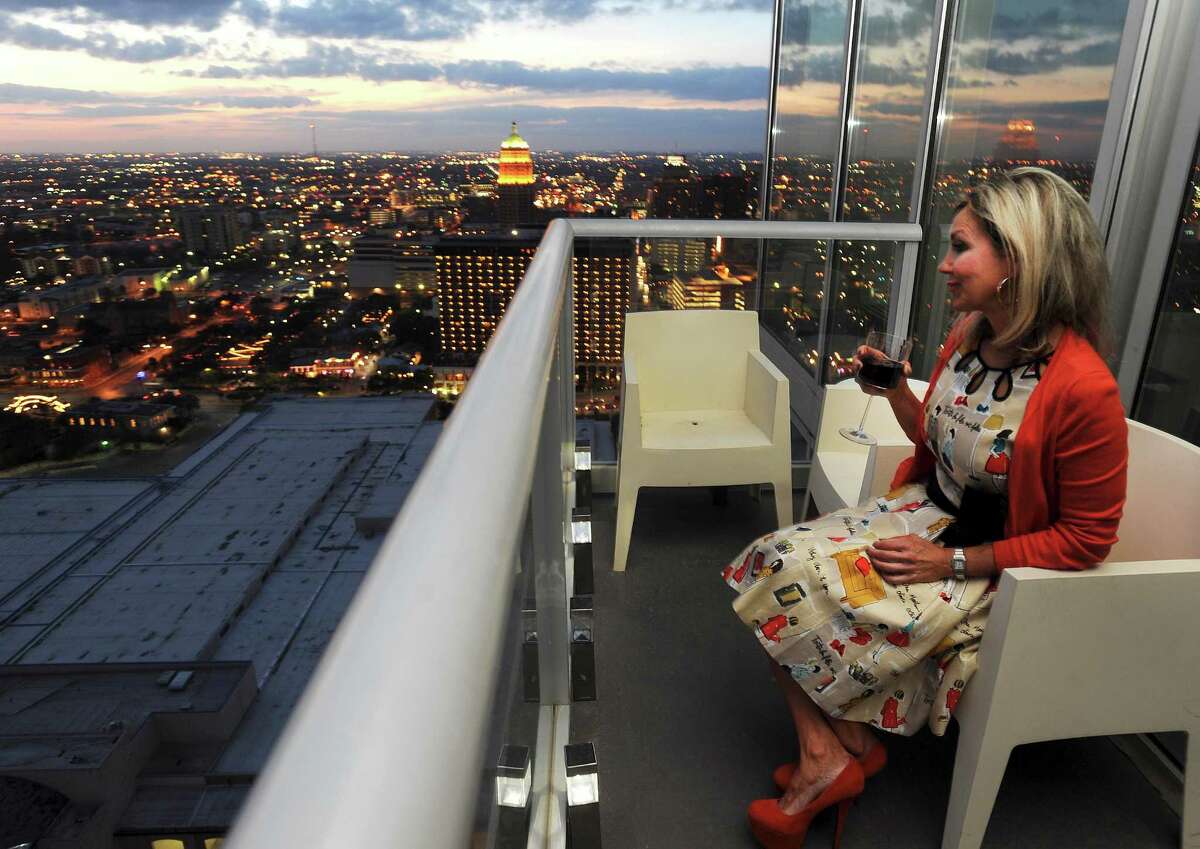 Andi Rodriguez lives at The Alteza at the top of the Grand Hyatt hotel. She appreciates a good wine and the view.