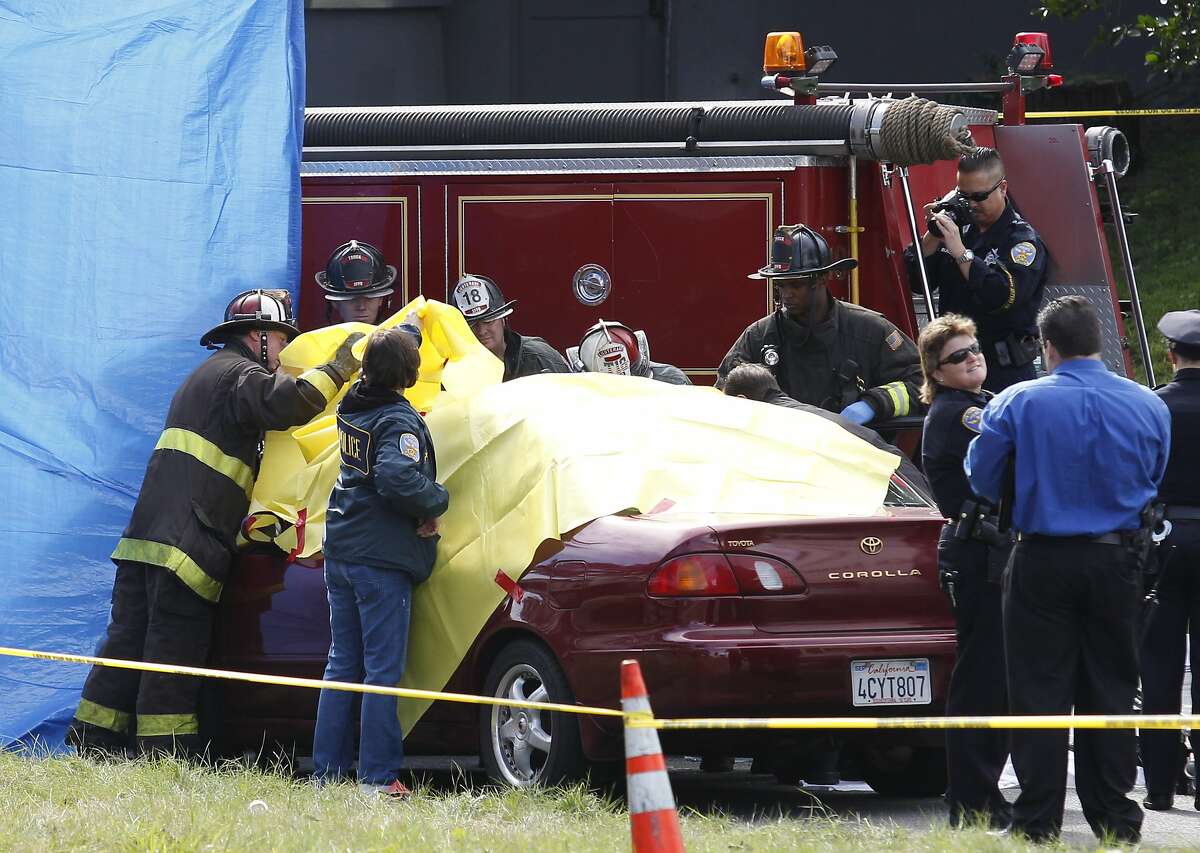 San Francisco firefighters and police officers attend to an accident scene involving a pedestrian death at the intersection of Yorba Street and Sunset Boulevard on Tuesday, February 4, 2014 in San Francisco, Calif.
