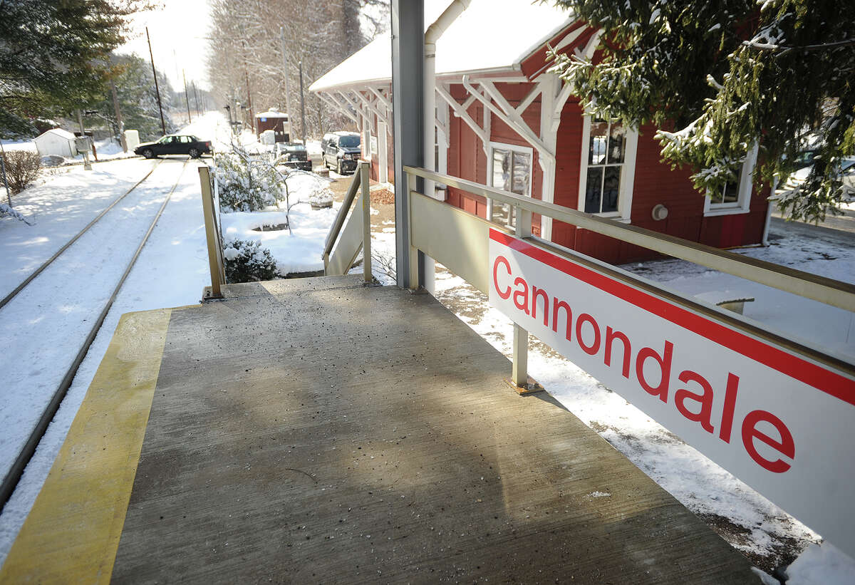 A car crosses the train tracks on Cannon Road in Wilton, Conn. next to the Cannondale station on Tuesday, February 4. 2014.
