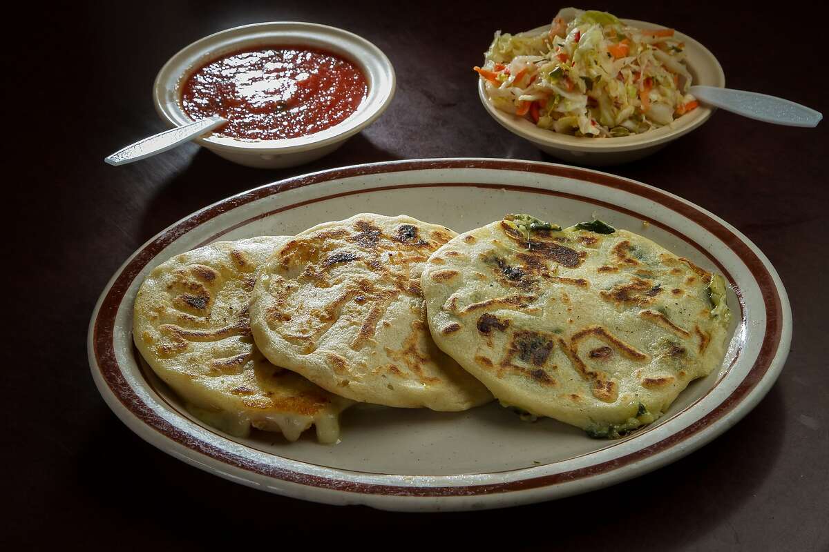 Left to right: Chicken with Loroco Pupusa, Chicken with Cheese Pupusa, and Spinach with Cheese Pupusa at Reina's restaurant in San Francisco, Calif., are seen on February 4th, 2014.