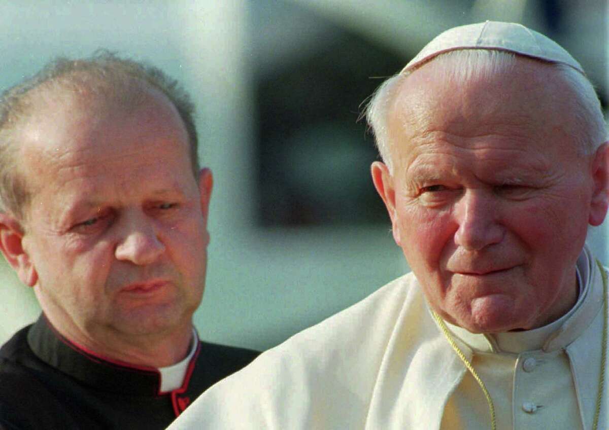 In his will, Pope John Paul II tasked his personal secretary, Stanislaw Dziwisz (left), with burning his personal notes after his death.