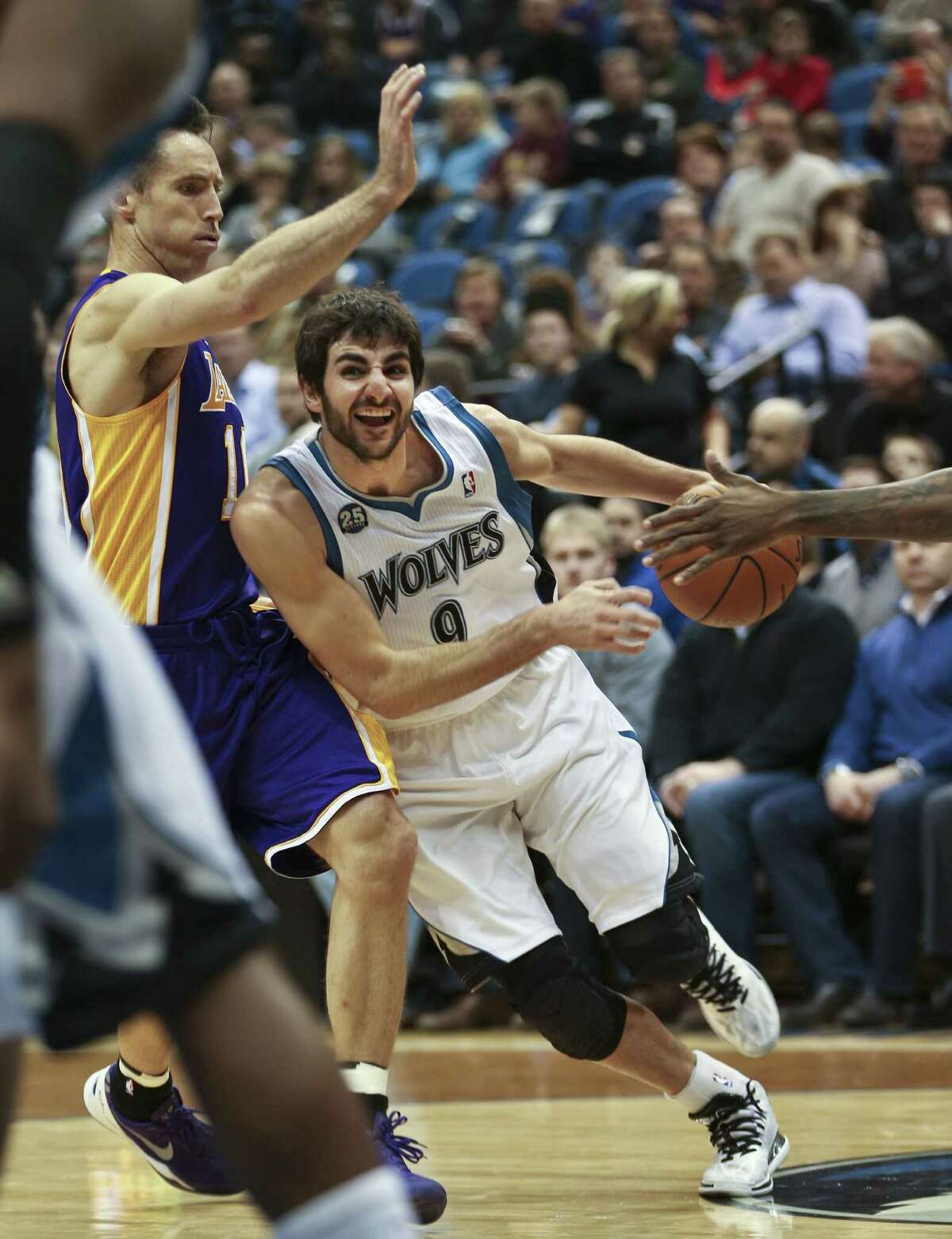 Minnesota guard Ricky Rubio drives past Lakers counterpart Steve Nash during the Timberwolves' 109-99 win. It was Nash's first game since Nov. 10.