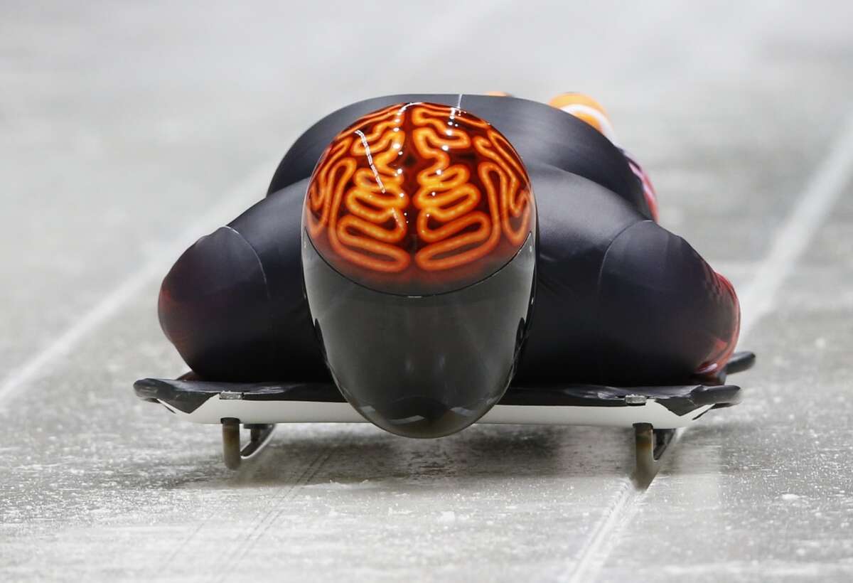 Canada's John Fairbairn is a heavy favorite for gold medal in the coolest skeleton helmet category at this year's Sochi Olympics. The neon brain helmet is brilliant and really shines with his near all-black suit. (Murad Sezer/Reuters)