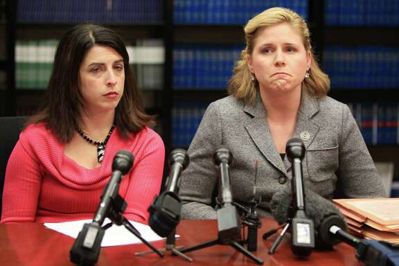 Prosecutors Alison Bainbridge and Janna Oswald announce the arrest at a news conference Wednesday.