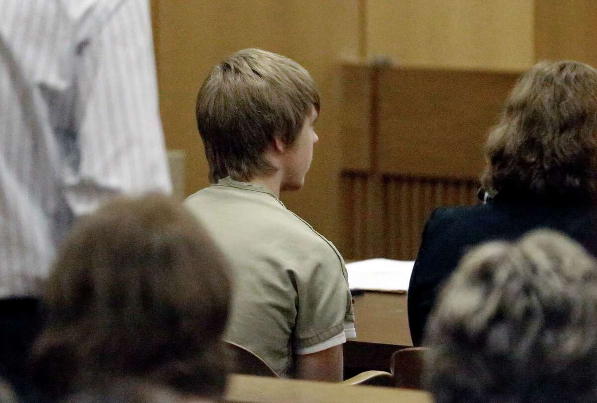 Ethan Couch, center, sits in juvenile court for a hearing about his future Wednesday, Feb. 5, 2014, in Fort Worth, Texas. Judge Jean Boyd again decided to give no jail time for Couch, who was sentenced to 10 years' probation in a drunken-driving crash that killed four people, and ordered him to go to a rehabilitation facility paid for by his parents. The sentence stirred fierce debate, as has the testimony of a defense expert who says Couch's wealthy parents coddled him into a sense of irresponsibility. The expert termed the condition "affluenza." (AP Photo/LM Otero)