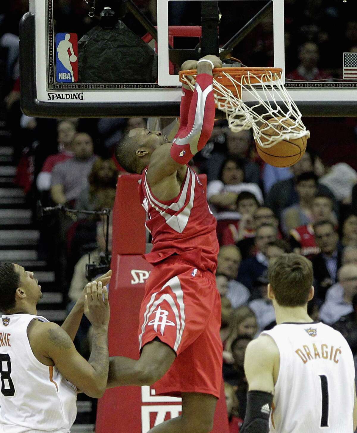 Dwight Howard dunks for two of his 34 points over Suns Channing Fry and Goran Dragic during the Rockets' win in Houston. Howard added 14 rebounds.